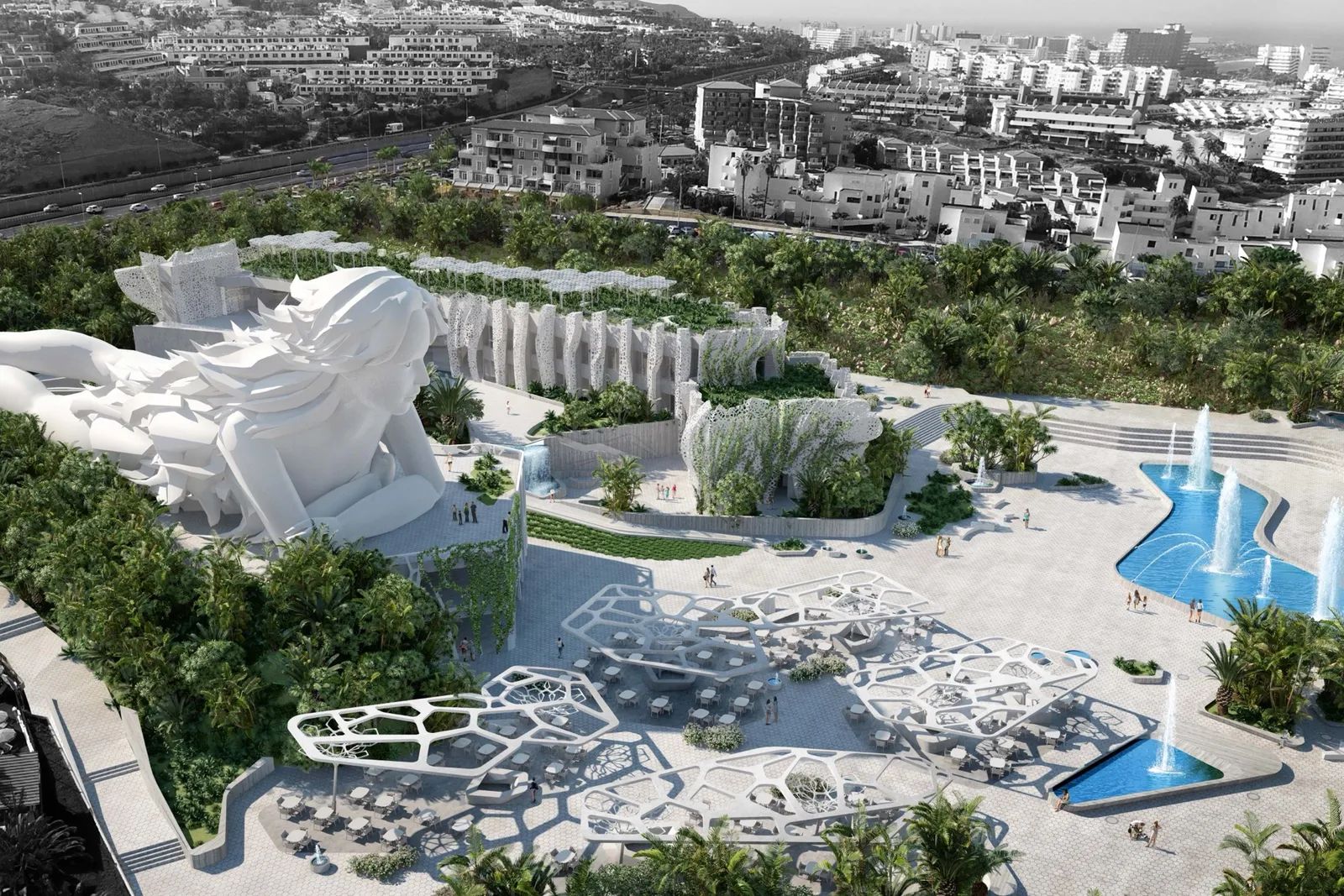 Vista aérea del complejo de bienestar, una figura reclinada colosal entre jardines aterrazados, pabellones y fuentes sobre la localidad.