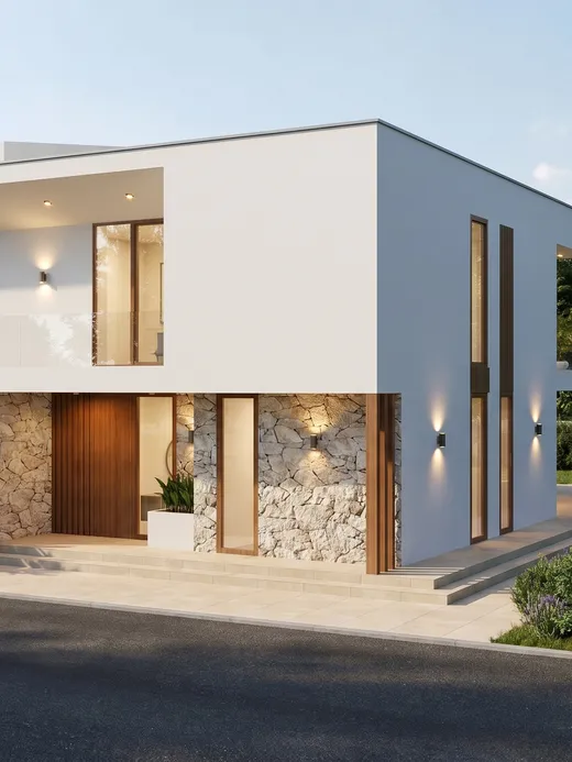 Front facade of Marea villa at dusk with a timber-slat garage door, split-face stone entry wall, and a covered upper terrace lit from within.