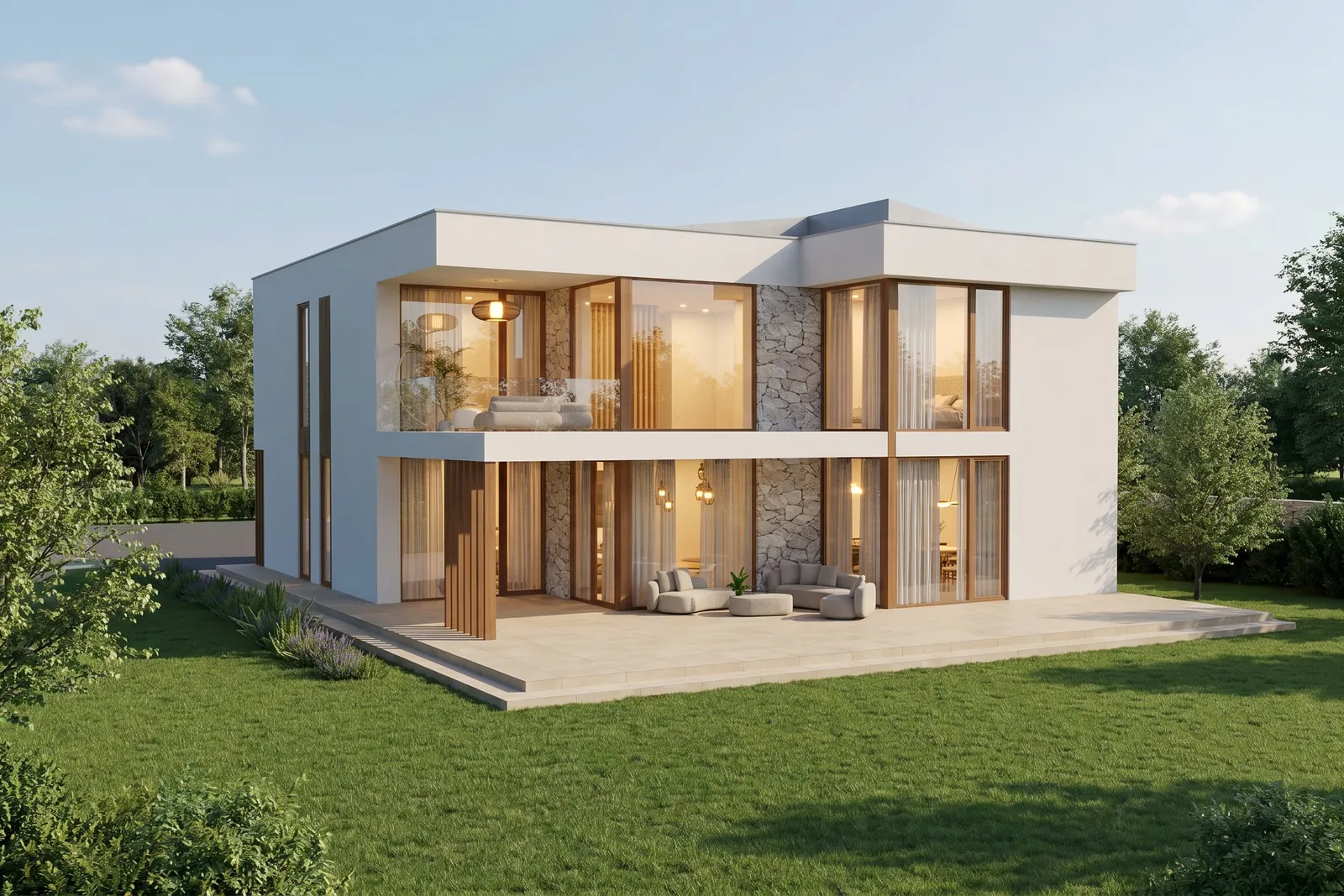 Rear facade of Marea villa at dusk with an open terrace lounge, folding glass doors, and interior lighting glowing through stone-clad columns.