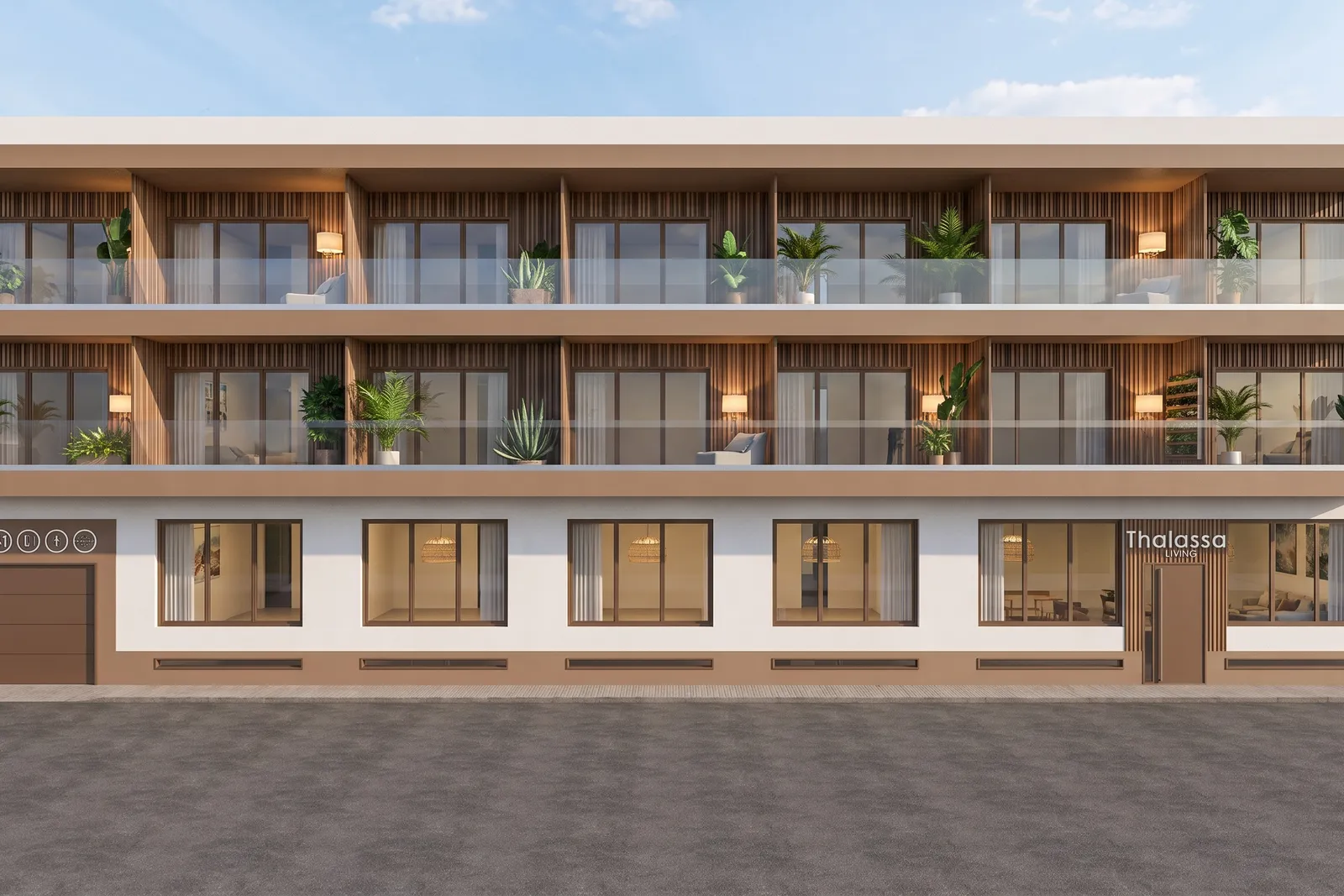 Dzienny widok pod kątem na budynek Thalassa Living, ukazujący balkony ze szklanymi balustradami, wjazd do garażu na parterze oraz szyld Thalassa Living.