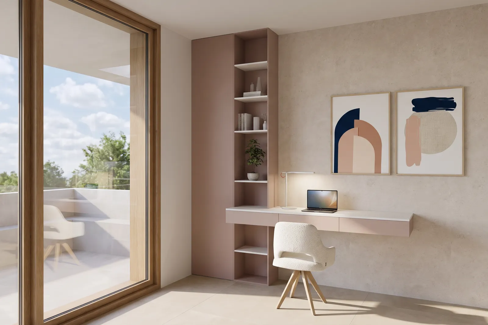 Rincón de escritorio empotrado con mobiliario en tono rosa empolvado, estanterías abiertas, una lámpara de trabajo y un par de obras abstractas junto a una puerta acristalada a la terraza.