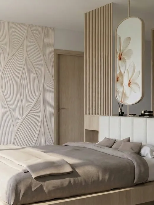 Primary bedroom with a sculpted wave-pattern feature wall, a floating oak bed, and a floral-motif backlit mirror panel.