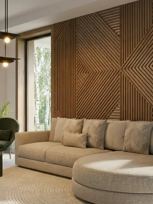 Open-plan living room with a geometric timber-slat feature wall, a curved beige sofa, and full-height windows framing the garden.