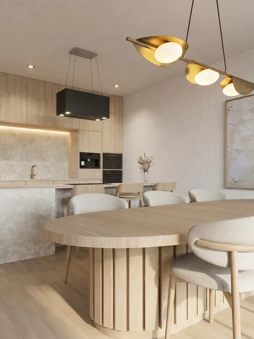 Open-plan living room with a stone-clad media wall, round bulb pendant lights, and low upholstered seating, with the kitchen visible beyond.