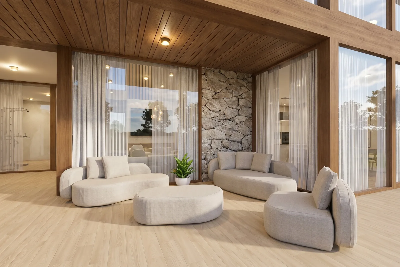 Double-height family lounge under a wood-clad ceiling, with curved upholstered sofas, a stone accent wall, and glazed views into the garden.